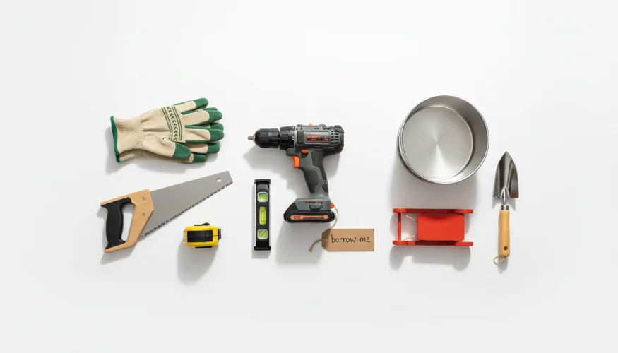 Flat-lay of household items available for borrowing in a neighborhood sharing initiative